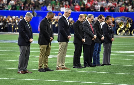 Louisiana officials and both school presidents on the field during a moment of silence of remembrance of the Bourbon Street attack. Photograph: James Leyva/ZUMA Press Wire/REX/Shutterstock