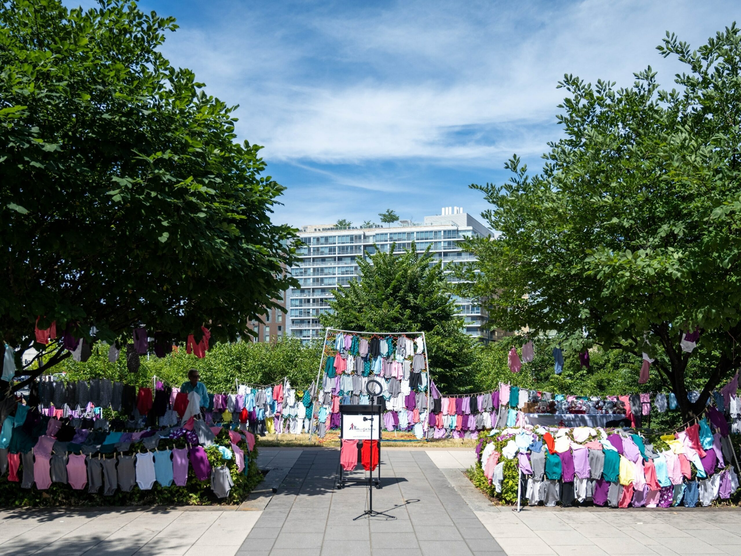 1,086 onesies were displayed across the street from the U.S. Department of Transportation building in Washington, DC on June 20, 2024 representing each child that has died in a hot car in the U.S. since 1990.